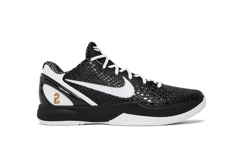 A front view of the outer side of the right shoe of the Kobe 6 Protro ‘Mambacita Sweet Sixteen,’ showcasing its predominantly black PU material and overall silhouette.