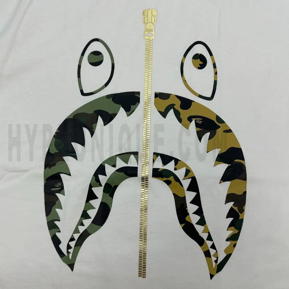 Detailed shot capturing the graphic print on the white tee's front panel.