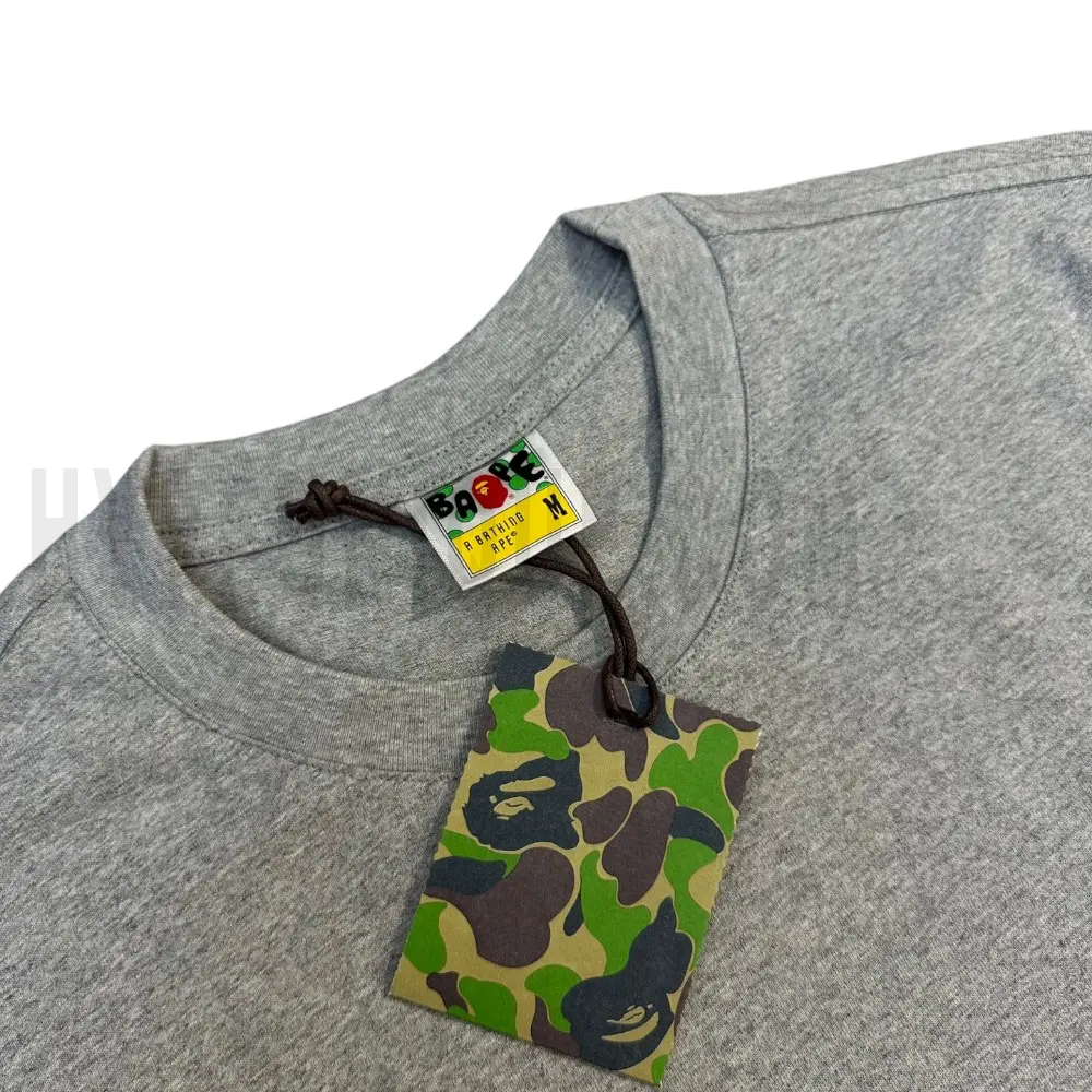 Neckline tag close-up, displaying garment care symbols and brand information with fashion-forward presentation.