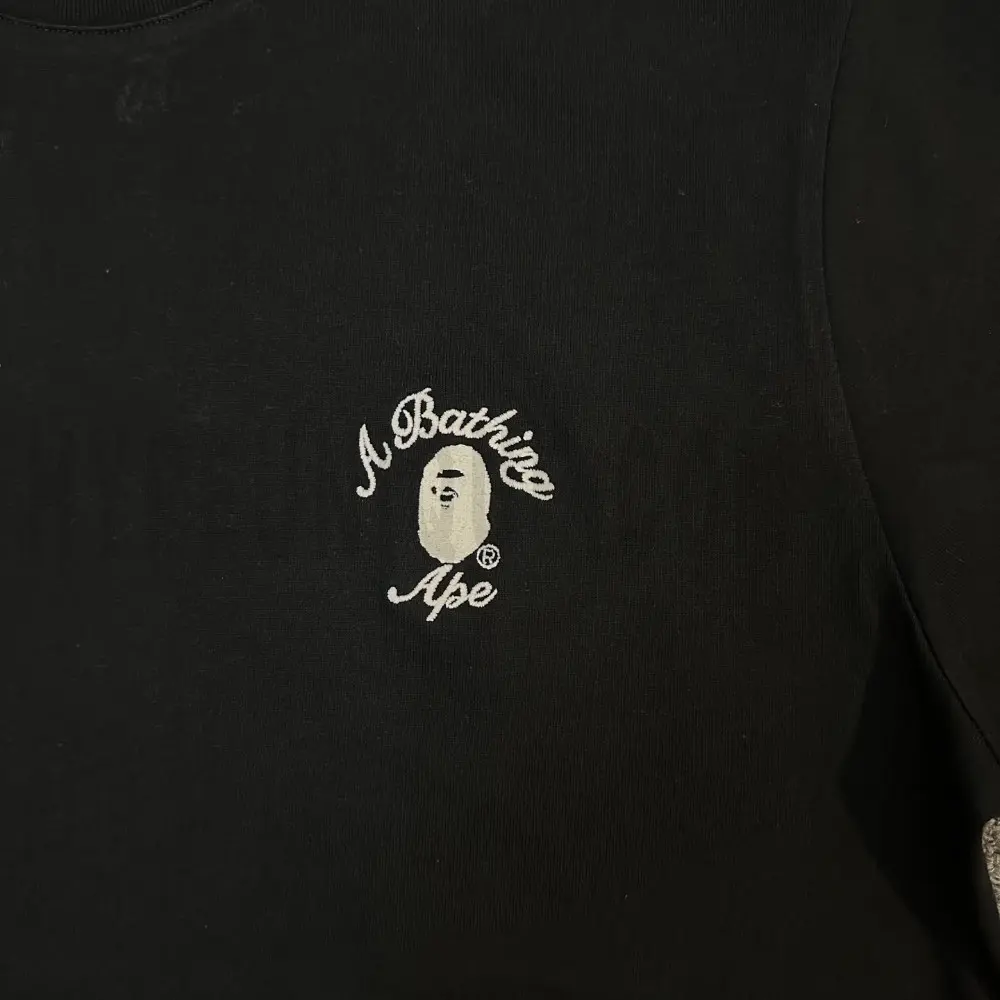 Close-up of the T-shirt print details of the front of the black clothes.