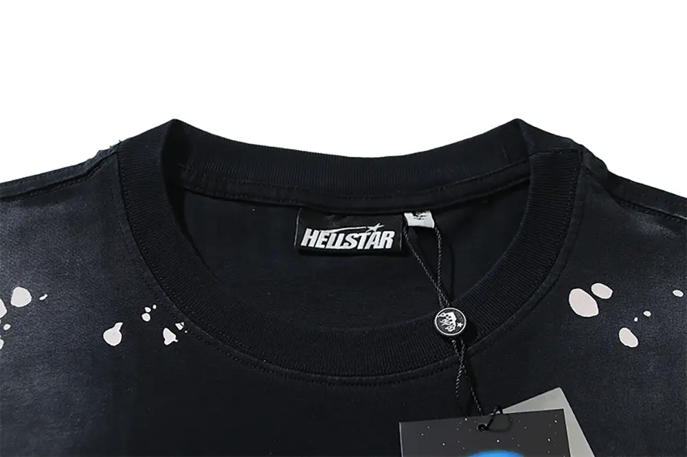 Close-up of the T-shirt's neckline tag, showcasing wash care instructions and brand details in a fashion design.