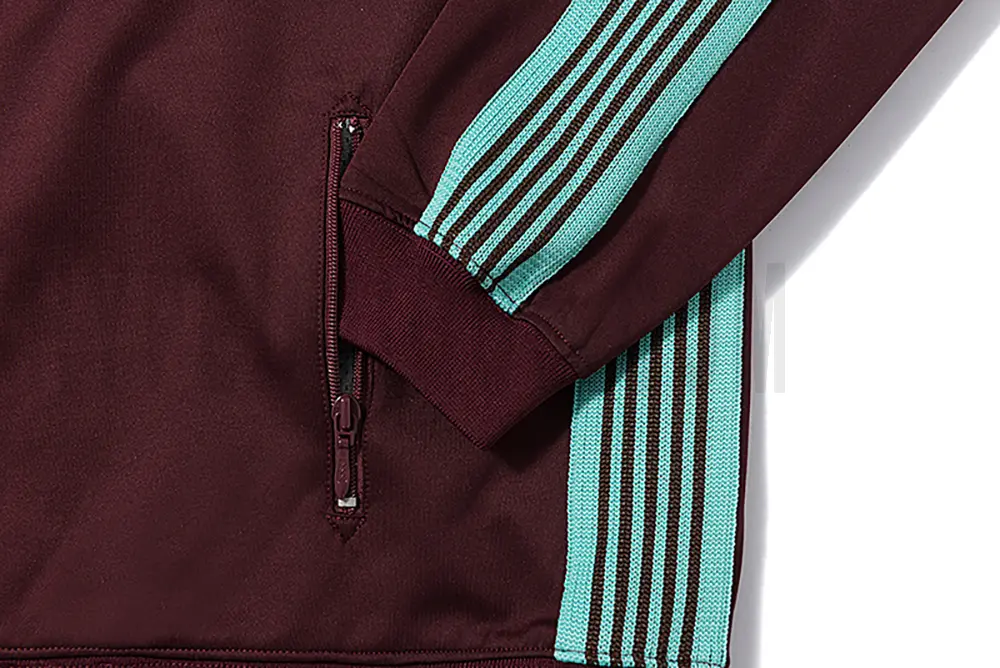 Close-up of sleeve stripe detail on the jacket.