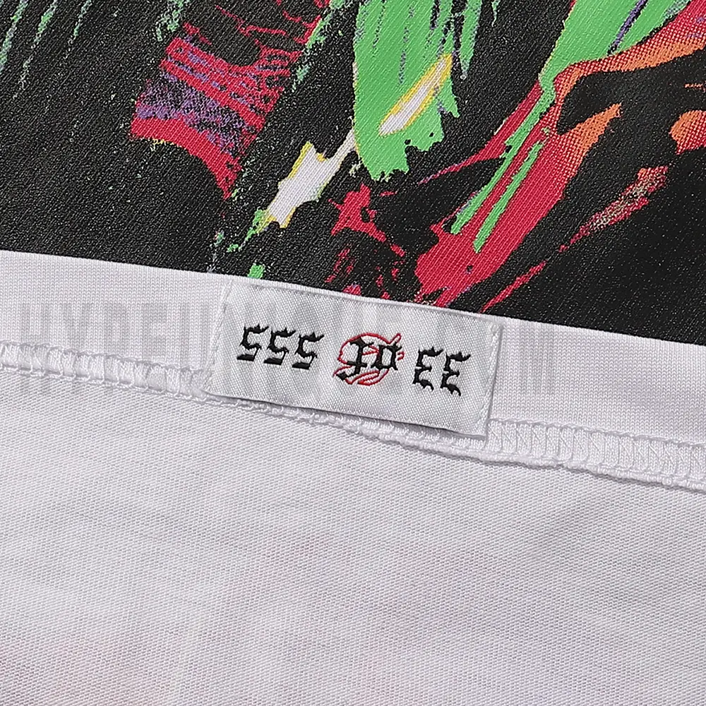 Clean hemline finish with a modern cut, highlighting the T-shirt's streetwear aesthetic.