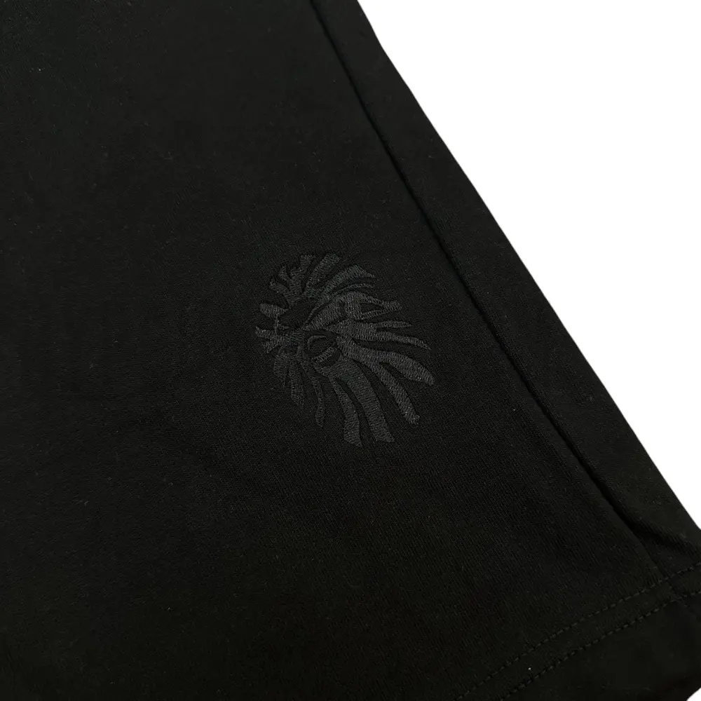 Embroidered graphic on the front of the shorts