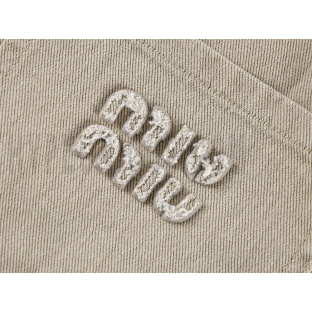 Embroidered graphic on the front of the pants