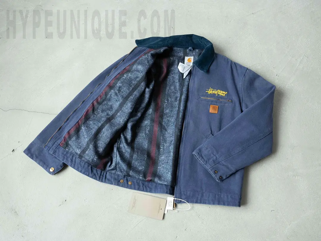 Carhartt X Stussy J97 Jacket in blue, front interior view. Showing the dark blue blanket fleece fabric.