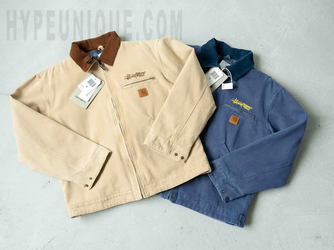 Carhartt X Stussy J97 Jacket in beige and blue front view.