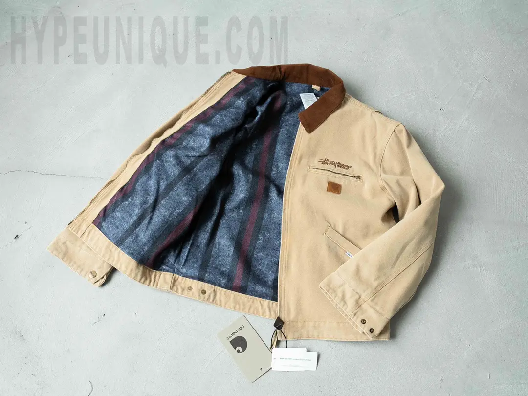Carhartt X Stussy J97 Jacket Beige Front Interior View. Showing the dark blue blanket fleece fabric.