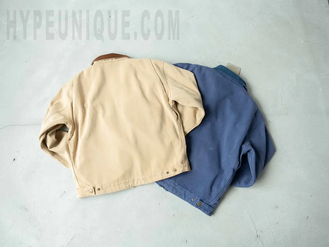 Carhartt X Stussy J97 Jacket in beige and blue back view.
