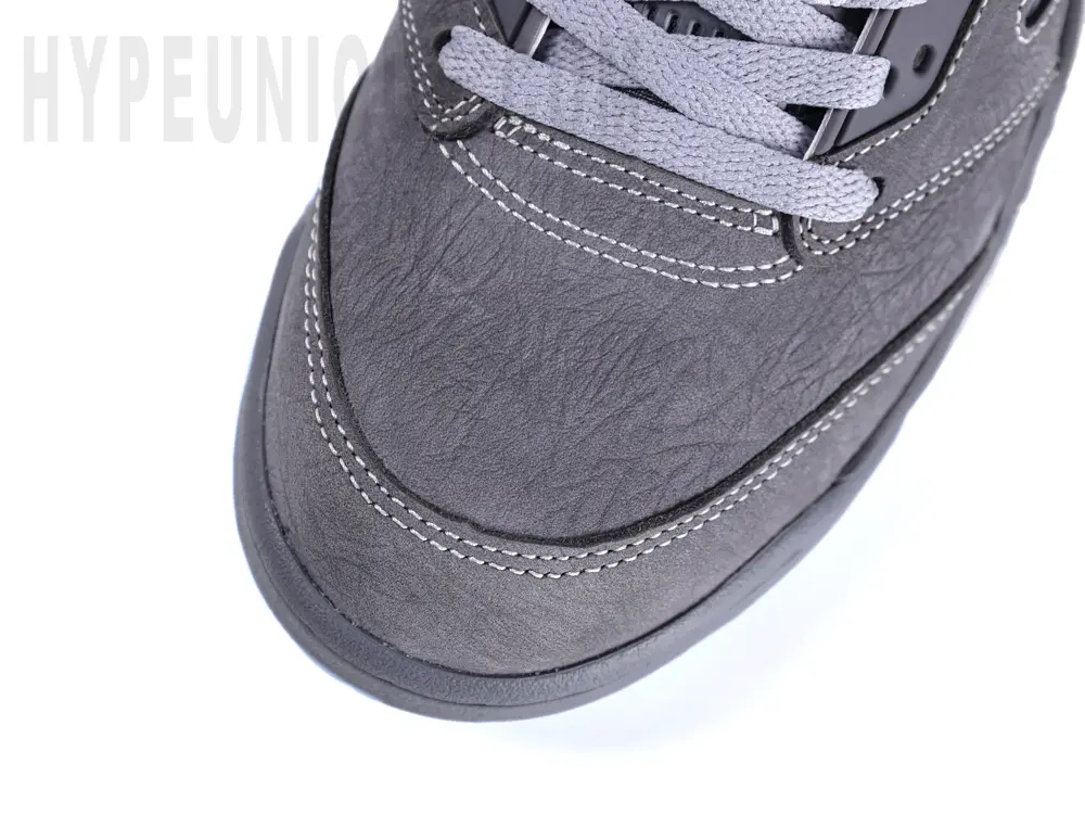 Close-up top view of the Jordan 5 ‘Wolf Grey’ toe area, showing the grey suede mudguard and toe box.