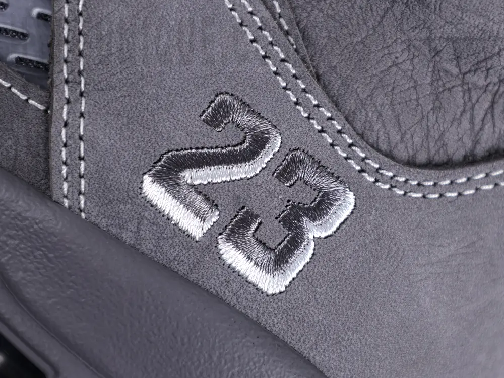 3D grey-and-white embroidered “23” logo on the Jordan 5 ‘Wolf Grey’.
