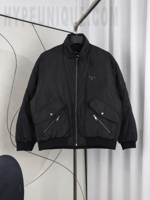 Front view of the PRD Metal Triangle Logo Nylon Down Jacket, featuring an all-black design and nylon fabric construction.