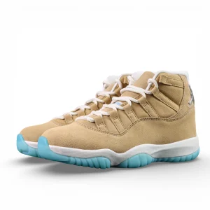 Tan suede sneakers with white laces and blue rubber soles.