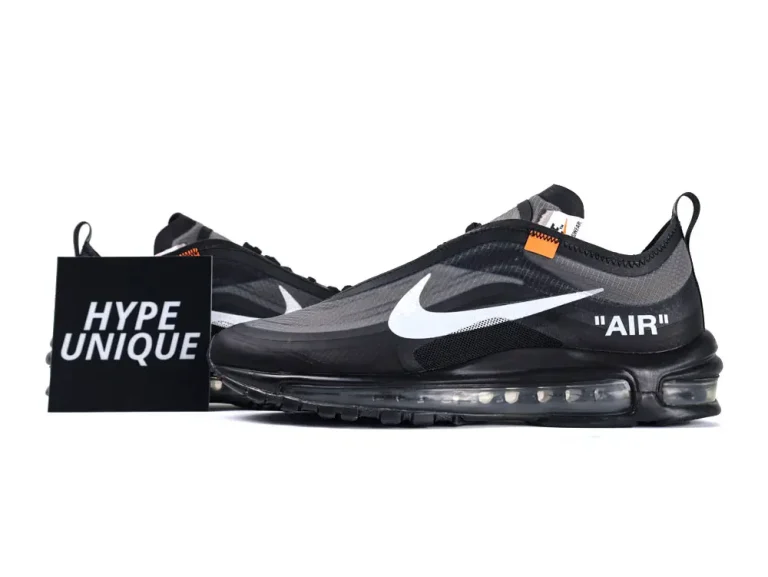 Black mesh sneakers with white logo, transparent sole, and orange accents.