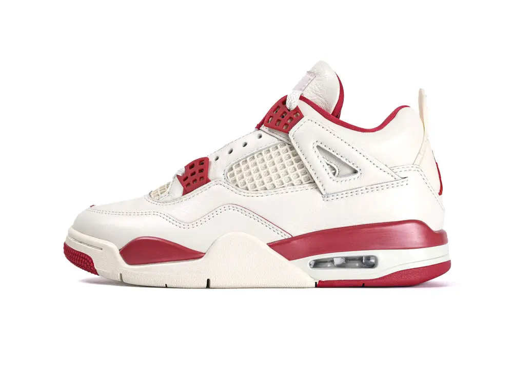 White and red leather sneaker with mesh panel and visible air cushioning.