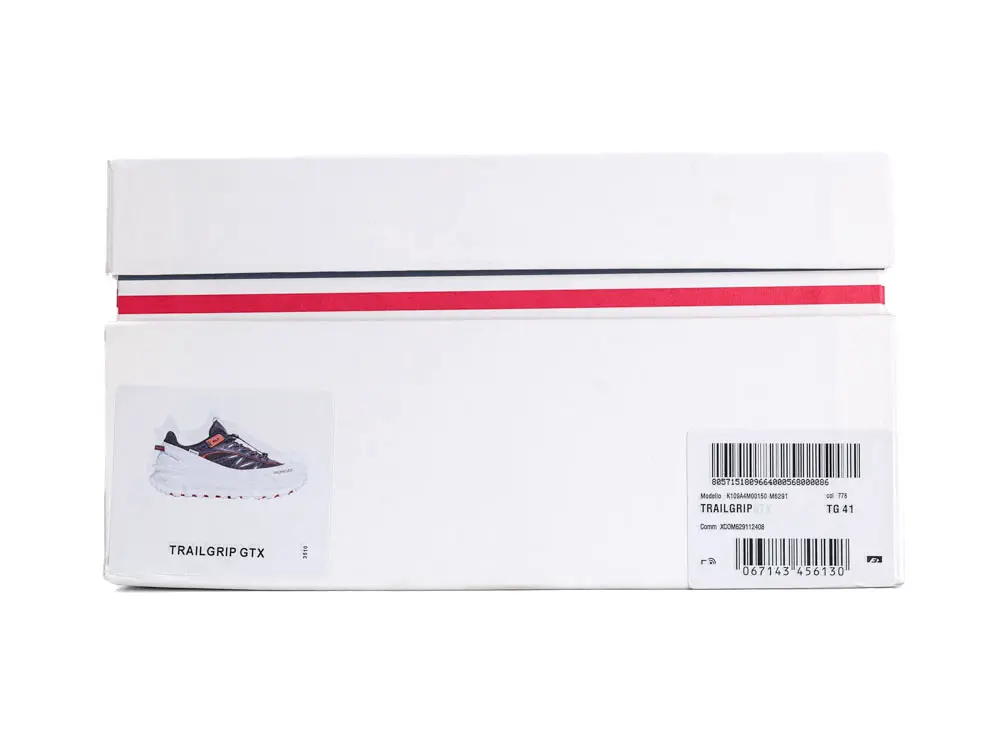 White cardboard shoebox with red and black details, featuring a sneaker image.