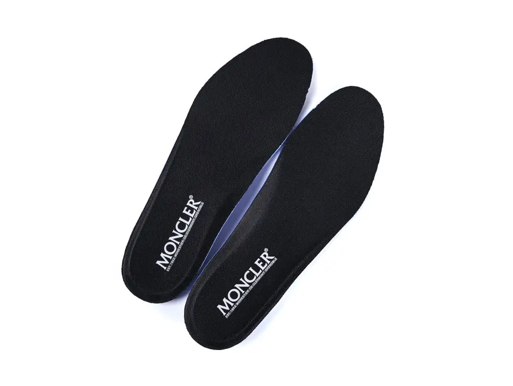 Black fabric insoles with white logo, featuring a sleek and comfortable design.