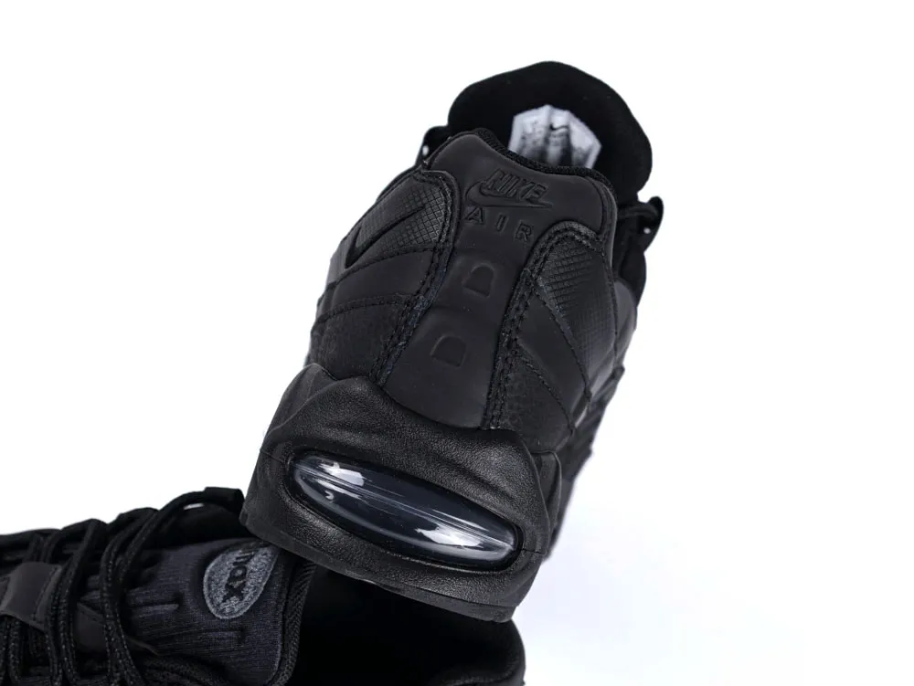 Black leather sneaker with visible air cushion on the sole, displaying heel detail.