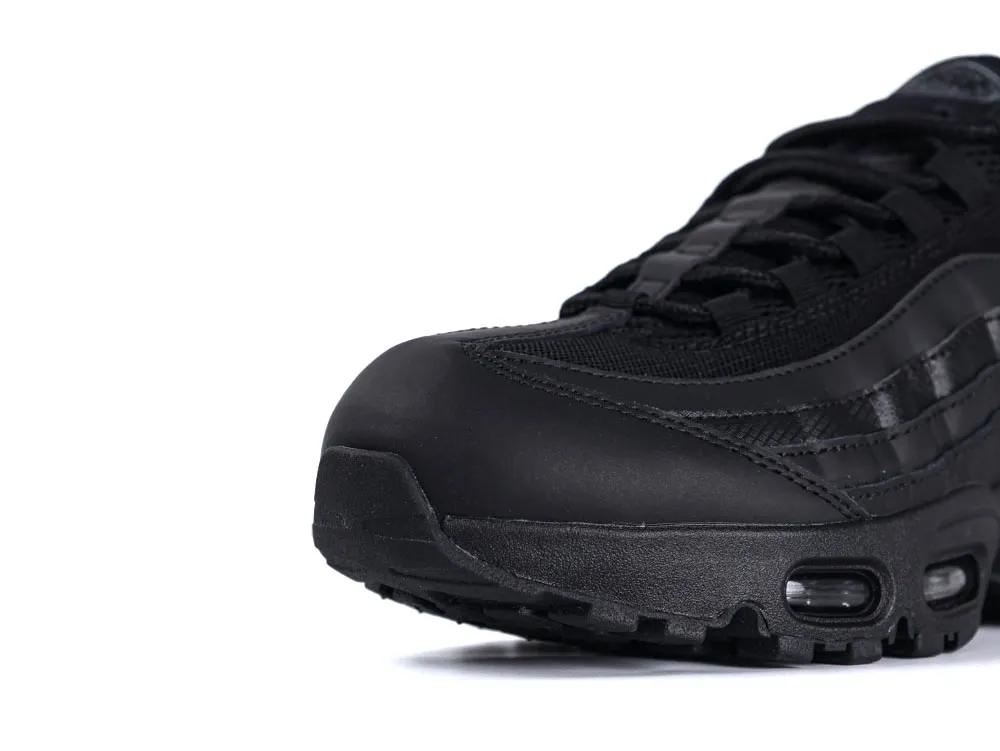 Black leather and mesh sneaker with visible air cushioning in the sole.