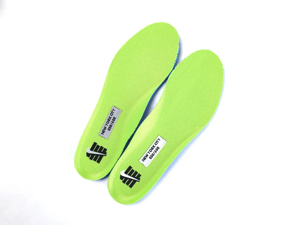 Bright green fabric insoles with black logos and text, featuring NYC details.