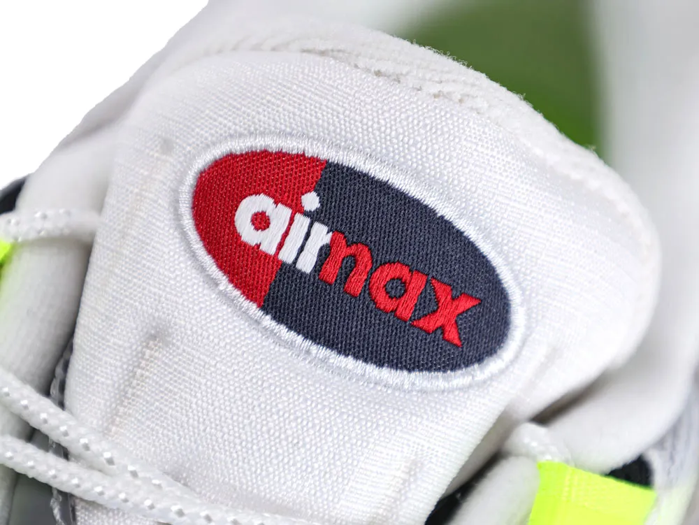 White fabric sneaker tongue with red and black logo detail.