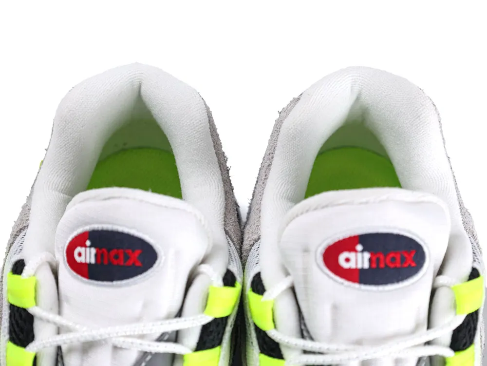 Top view of sneakers with white, gray fabric and neon green accents.