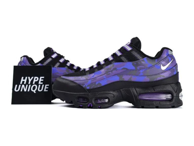 Purple and black camo sneakers with a synthetic upper and black sole.