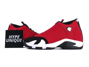 Red and black sneakers with suede material, featuring a distinctive white sole design.