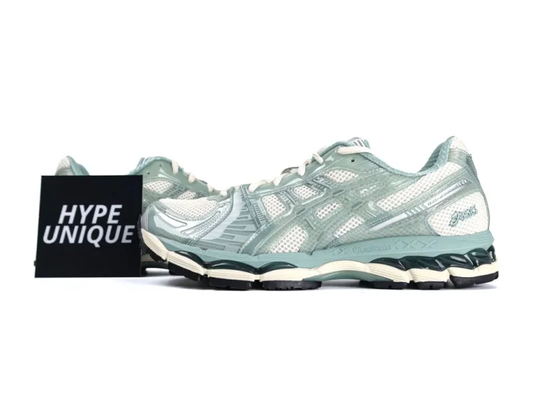 Mint green mesh sneakers with white accents and a sturdy rubber sole.