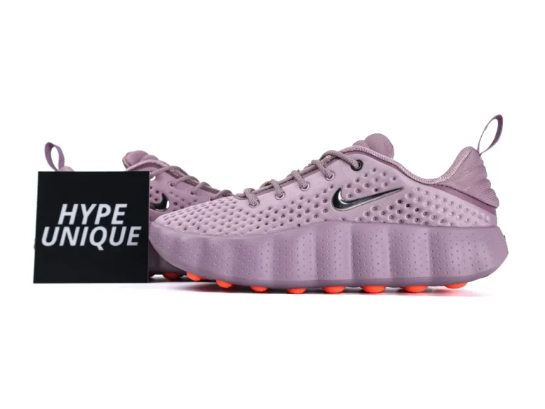 Purple perforated sneakers with orange sole accents and a sleek black logo detail.