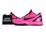 Pink and black sneakers with textured fabric and mesh, featuring Nike swoosh design.