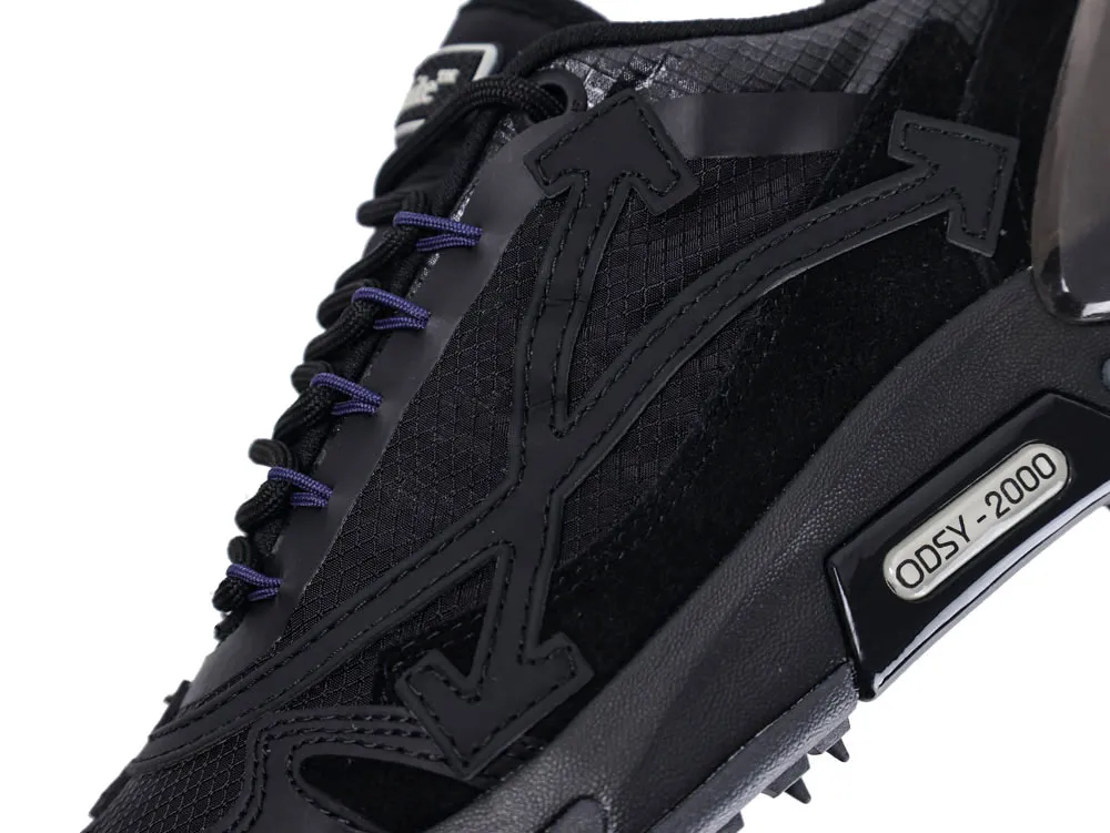 Black sneaker with textured fabric, purple laces, and "ODSY-2000" detail on the side.