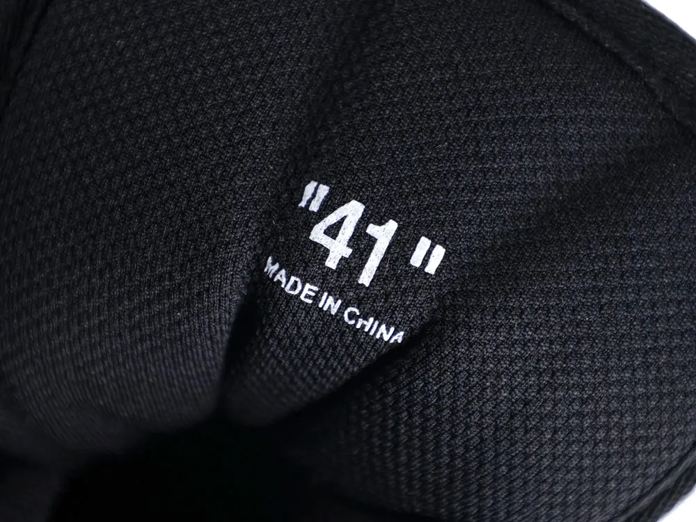 Black textured fabric with "41" printed in white, made in China.