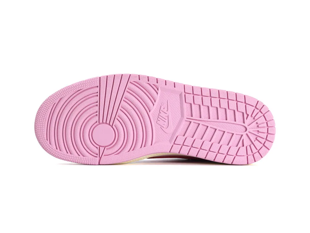 Pink rubber shoe sole with textured grip pattern and branding.