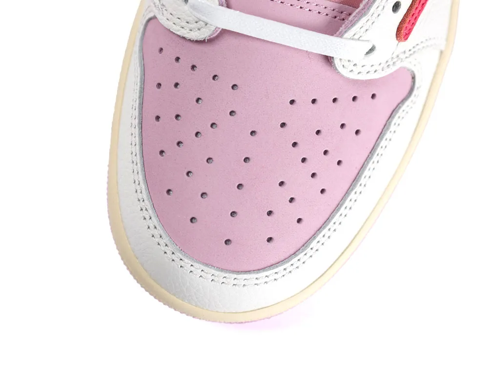Pink leather sneaker toe with white trim and perforations for breathability.