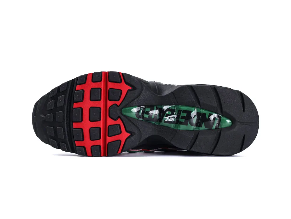 Black and red rubber sneaker sole with green transparent section in the center.