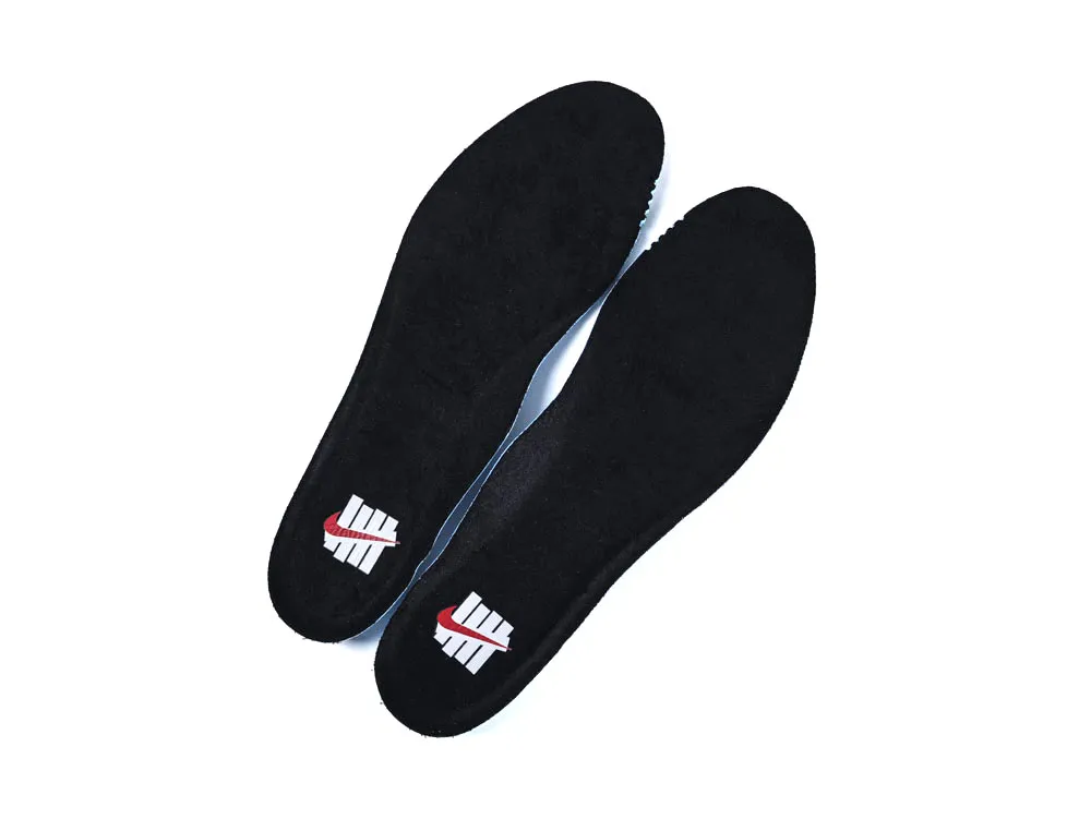 Two black shoe insoles made of soft material, featuring red and white logo.