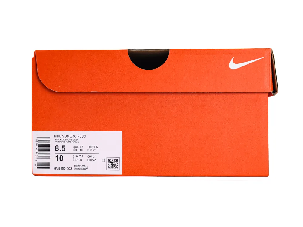 Orange cardboard shoebox with a Nike logo and product label on the side.