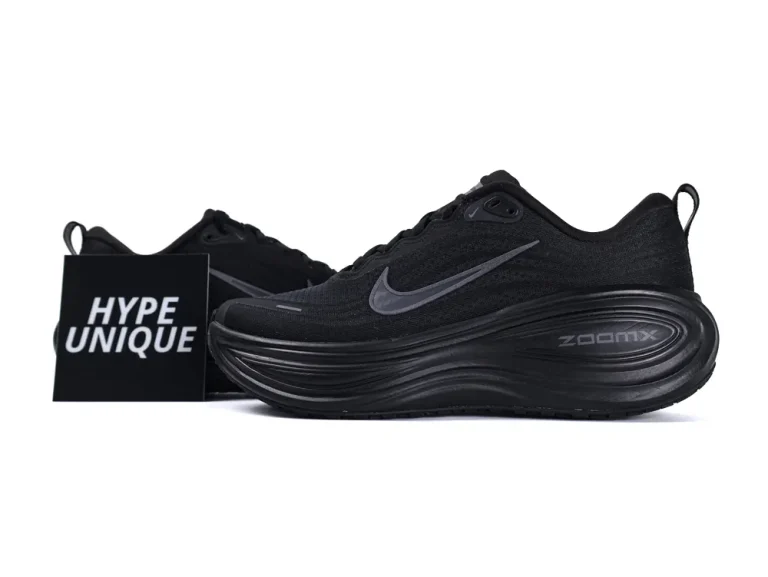 Black sneaker featuring a mesh upper and rubber sole, showcasing sleek design elements.