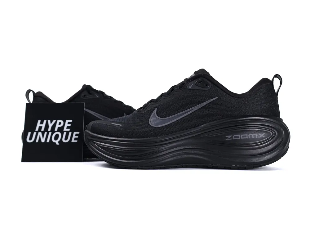 Black sneaker featuring a mesh upper and rubber sole, showcasing sleek design elements.