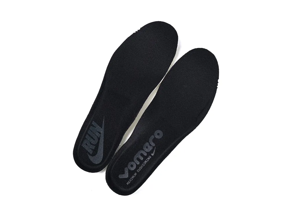 Black fabric shoe insoles with printed logos and cushioning material.