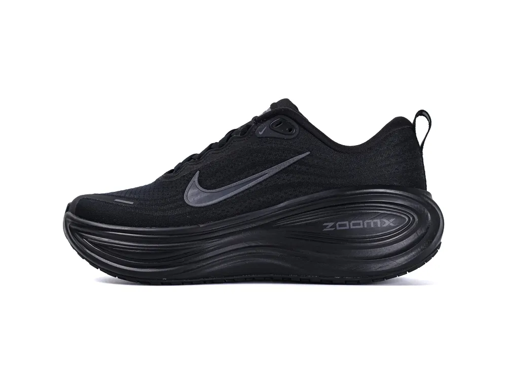 Black sneaker with mesh fabric upper, synthetic sole, and streamlined laces.
