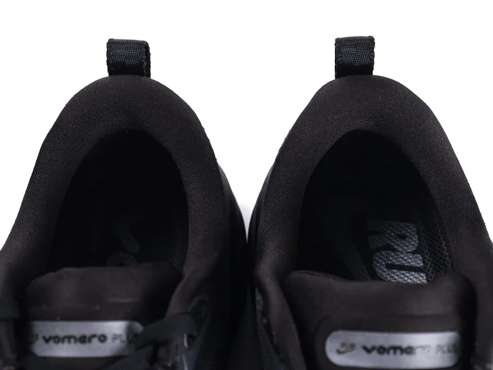 Black fabric sneaker insole with pull tabs, viewed from above.