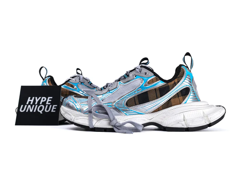 Colorful sneakers with blue and silver accents, plaid design, and textured white soles.