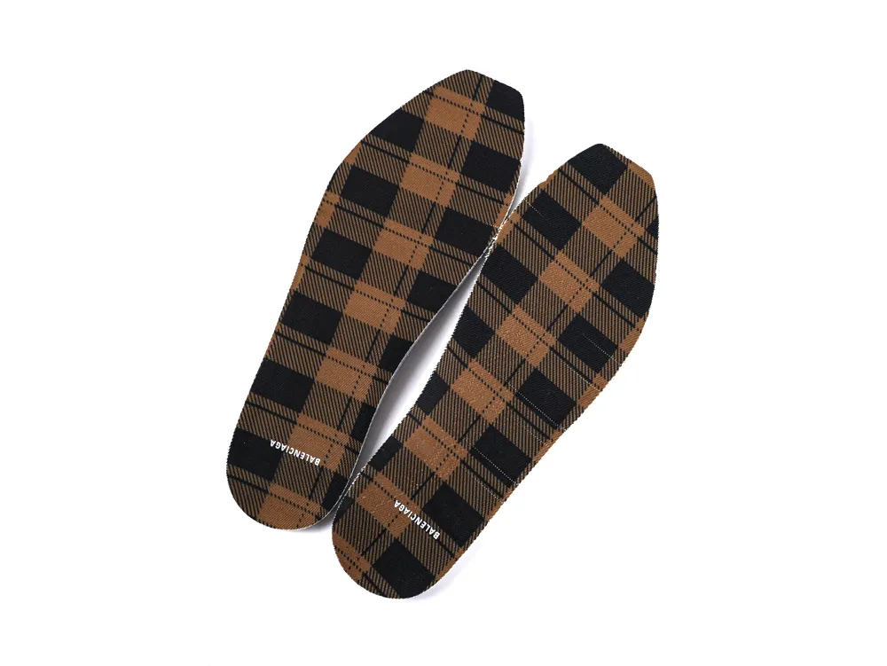 Brown plaid fabric insoles with black accents, Balenciaga branding on surface.
