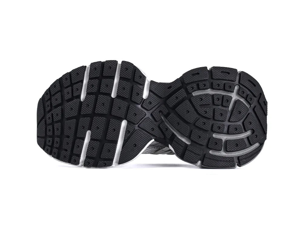 Black rubber shoe sole with textured pattern and white accents.