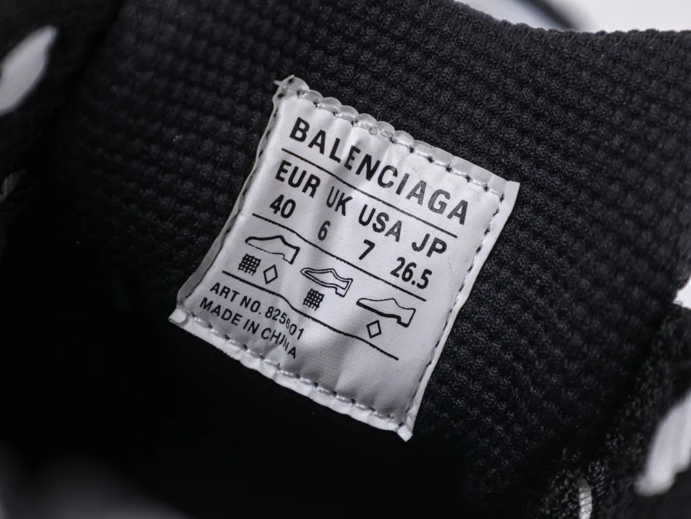 Black fabric shoe interior with a white label displaying size information.