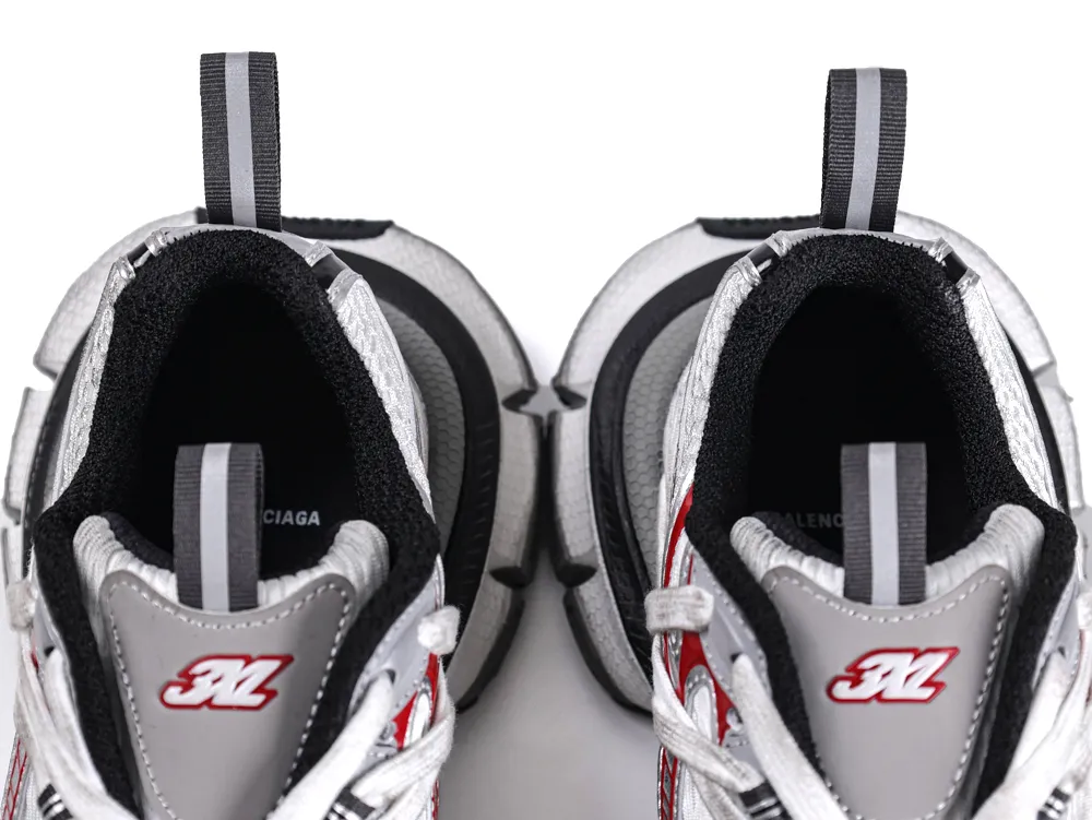 Top view of gray and red sneakers with textile lining and padded soles.