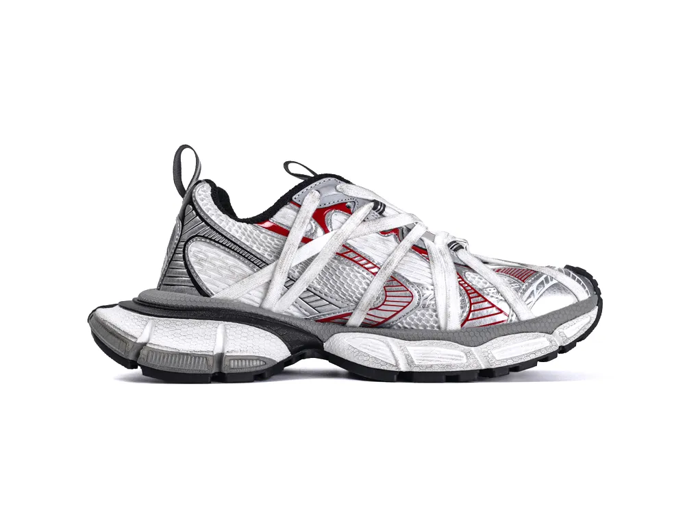 White and gray athletic sneaker with mesh material and red accents, featuring black sole.