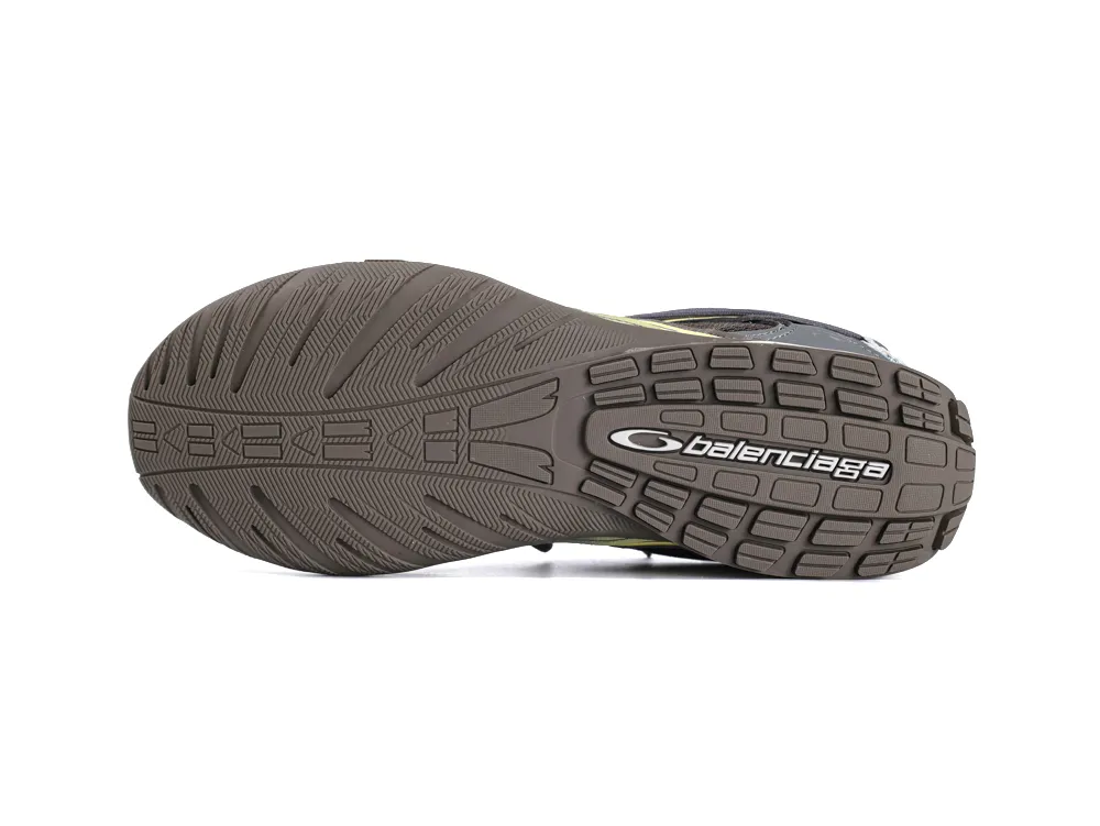 Brown rubber shoe sole with textured grip and brand logo.